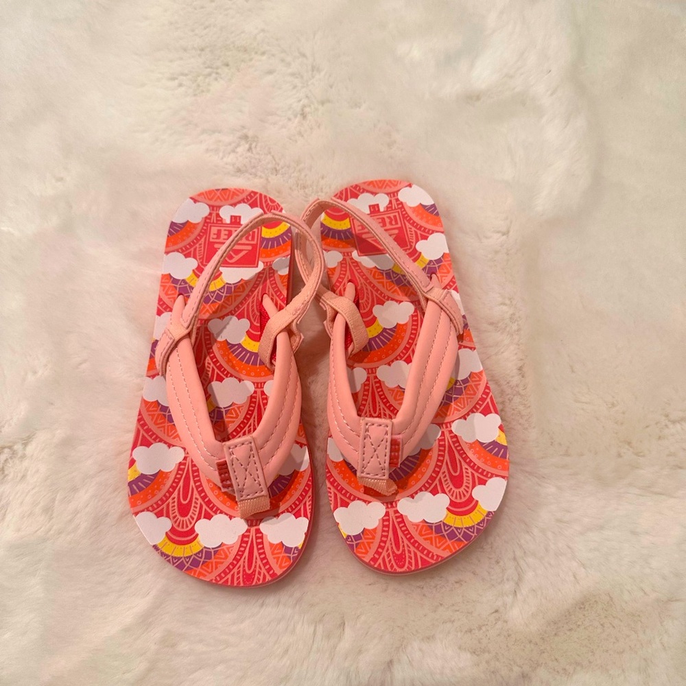 NWOT never used REEF flip flops size 11T.